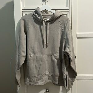 grey hoodie with drawstrings and pockets